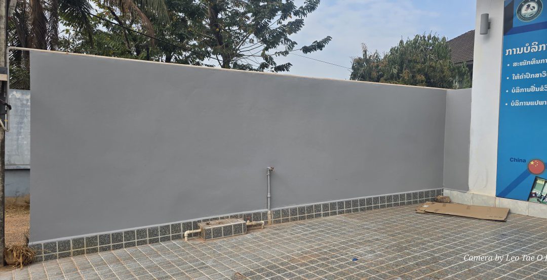 Acryrubber and Casaband SA on facade wall in Laos